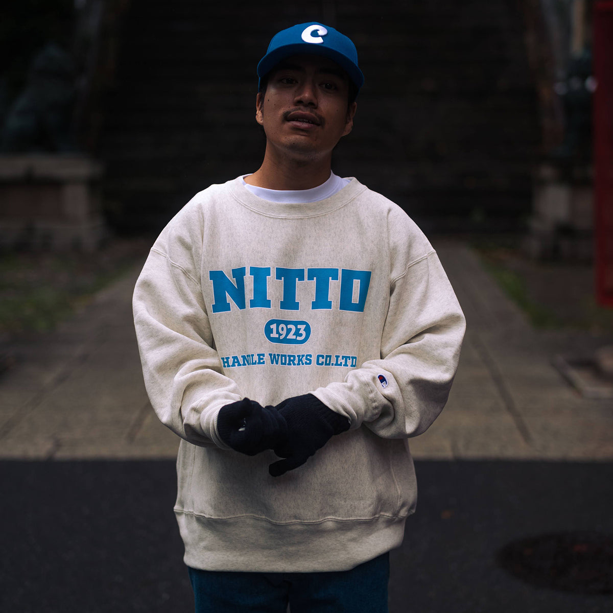 CHAMPION NITTO Collage Logo